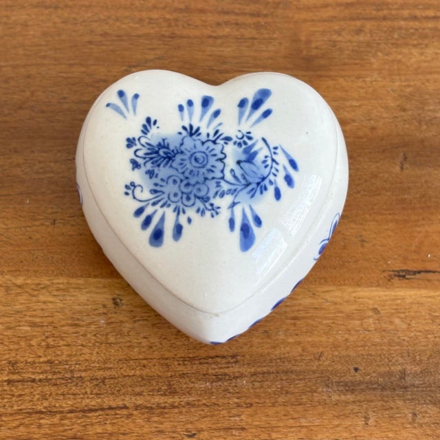 Charming tiny porcelain heart shaped box with hand-painted blue and white florals. Most items found at Pub & Oasis are...