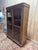A louis xvi period two-door display bookcase in solid fir veneer with a herringbone marquetry pattern (fern motif). all...