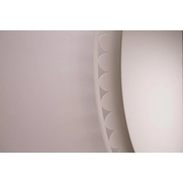 This illuminated oval mirror was designed by Ernest Igl in the 1960s for Hillebrand Leuchten. The mirror is backlit by 4...