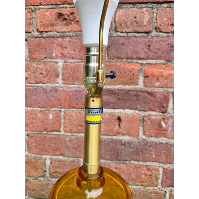 Mid-century Marbro Original Amber Glass Regency Style Lamp is just the standout piece for a bold room. This regency style...