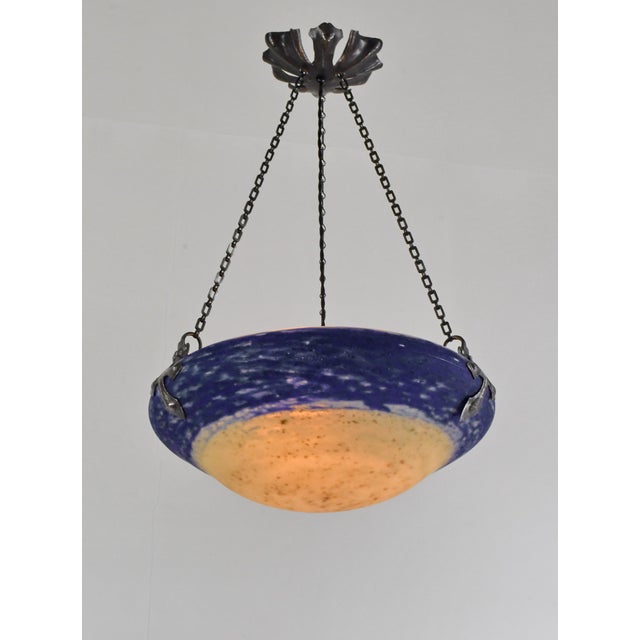 Daum freres & Louis Majorelle A wonderful French art deco hanging fixture in wrought iron with a Daum bowl in mottled...