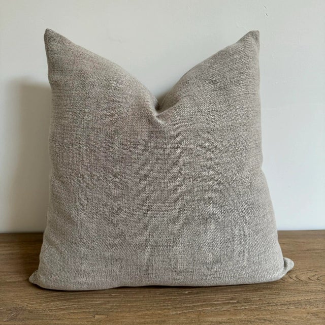 Linen Blend pillow in a natural color with a stone wash finish. Antique Brass Zipper closure Overlocked seams. Includes...