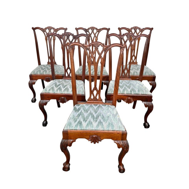 A set of 6 antique dining chairs. Chippendale style chairs with carved knees with claw and ball feet. The seats pop out...