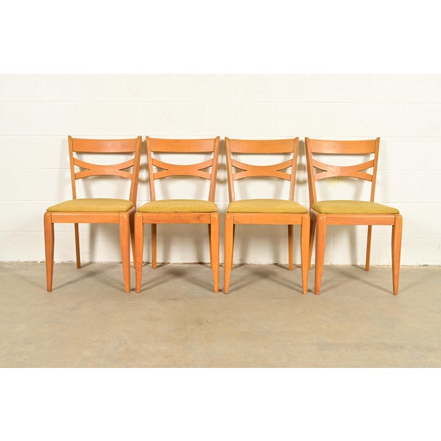 A gorgeous set of four Mid-Century Modern side chairs or dining chairs By Heywood Wakefield USA, 1950s Solid sculpted...