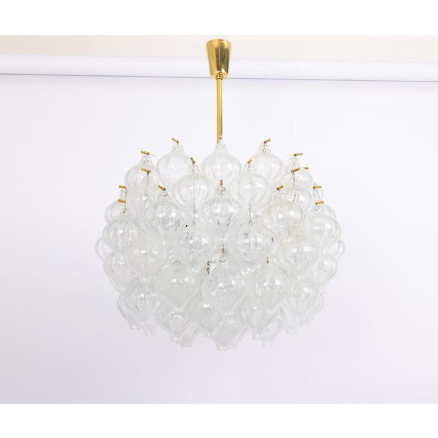 Wonderful onion shaped -tulipan glass chandelier. 73 hand blown glasses suspended on white painted metal frame and brass...