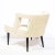 This graphic and sculptural arm chair was realized in the United States circa 1950. It features a barrel back with two...