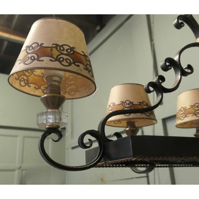 A very attractive piece in the french Country style, the light is made in wrought iron and comes with its original painted...