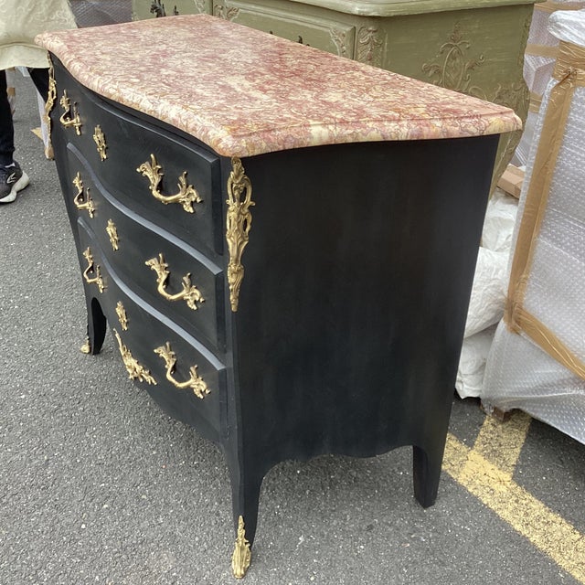 Very elegant black Louis XV style commode makes a statement painted black with its bronze dore drawer pulls and keyholes....