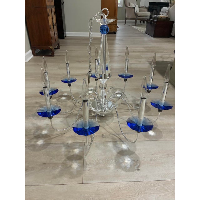 Jasmine 9 light Silver and Crystal Schonbek chandelier, signature optic crystal center column and sinuous silver arms...