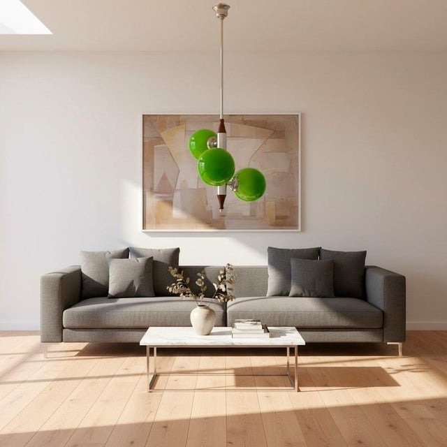 Mid-century modern sculptural pendant, likely dating from the late 1960s–1970s. The clustered globe composition reflects...