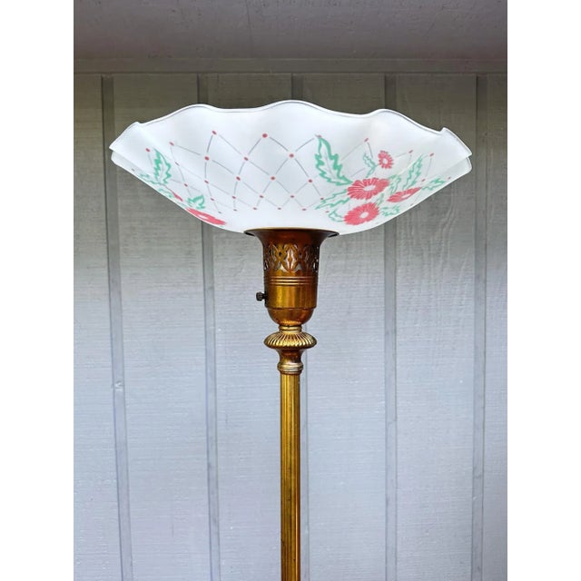 1940s torchiere lamp with a reverse painted, ruffled lampshade and a brass stem and brass and white onyx ornate base. It's...