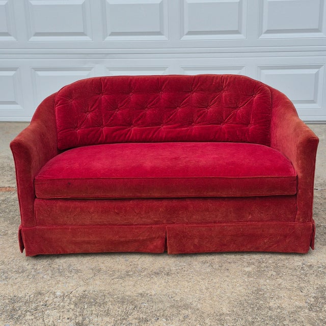 This a petite red velvet love seat by North Carolina based furniture maker Kay Lyn, Inc. It would make a great prop for...