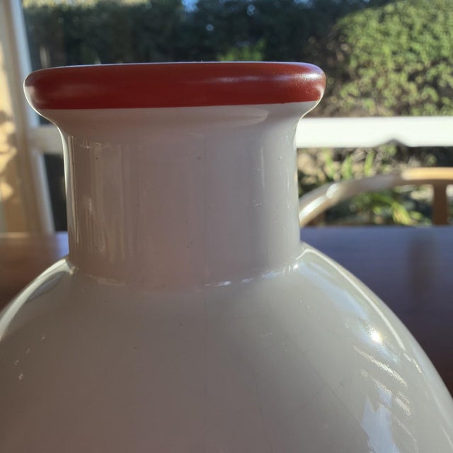 The Vintage Sommerhuber Austria Studio Nova White Ceramic Vase with an Orange Rim is a stunning decorative piece that...