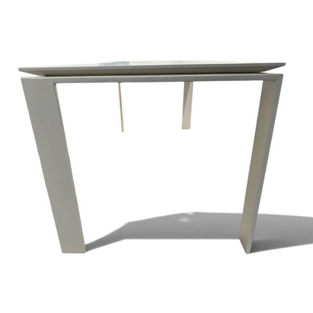 The Kartell Four Table, designed by Italian architect Ferruccio Laviani, (circa 2005), offers a modern and efficient...
