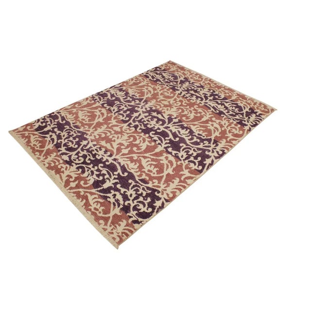 This elegant hand knotted rug features a modern fusion of beauty, with its interlocking geometric and minimalist pattern....