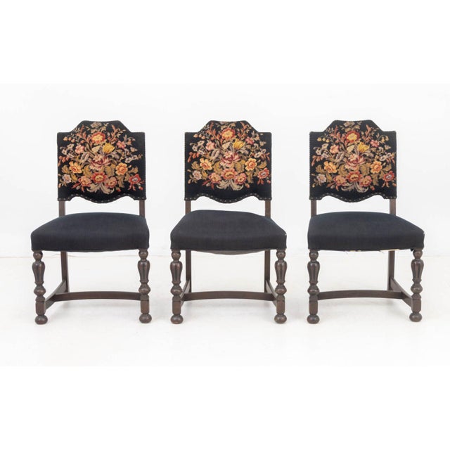 Set of Six Floral Needlepoint Upholstered Walnut Dining Chairs, one armchair and five side chairs. 38.5" H x 30.25" W x...