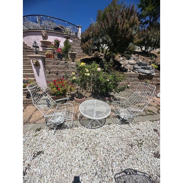 Vintage mid century patio set attributed to Homecrest. 3 piece set, wired armchairs that swivel and rocks and an...