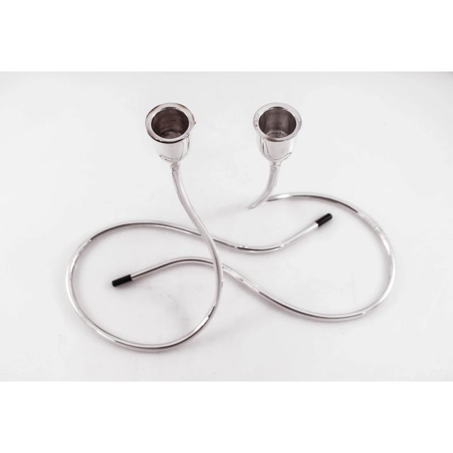 We are delighted to offer this pair of Mid-Century Modernist sterling silver candlesticks designed by Marion Anderson...