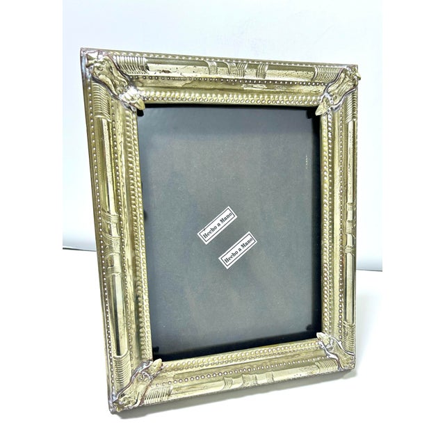 A beautifully detailed piece. It's a very handsome and striking picture frame. like that its not too fussy. There are 2...