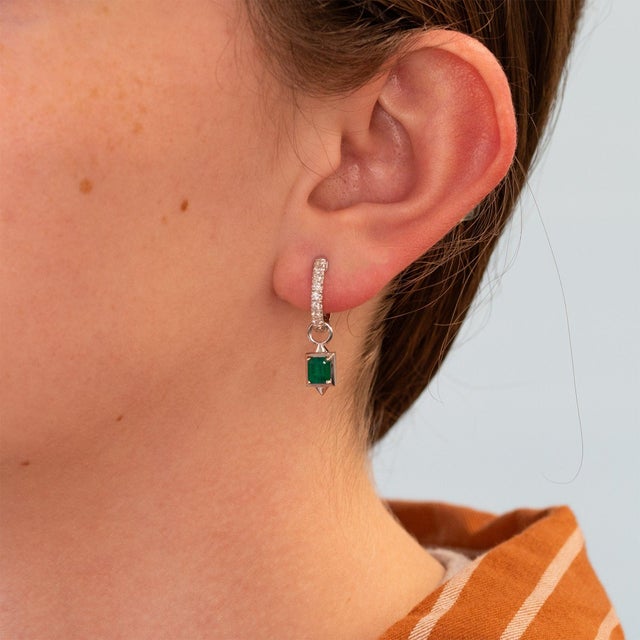 A clever 2-in-1 convertible design. Wear them as simple diamond hoops on their own, then attach the emerald drops to...