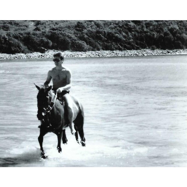 1980s photograph of a shirtless man horseback in the ocean on a Caribbean island. Unsigned and has a blank back. Combined...