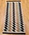 This exquisite vintage Navajo rug, dating from the mid-20th century, is a striking example of traditional Native American...