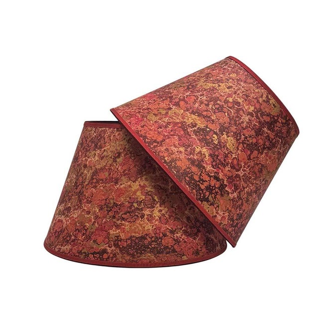 Marbled paper in a rich red, terra cotta and gold pattern; trimmed in two colors of grosgrain. Available in 3 sizes: 8” x...