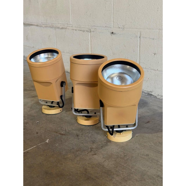 This set of 3 directional spot lights features industrial cylindrical shades with adjustable pivoting mounts. Vintage...