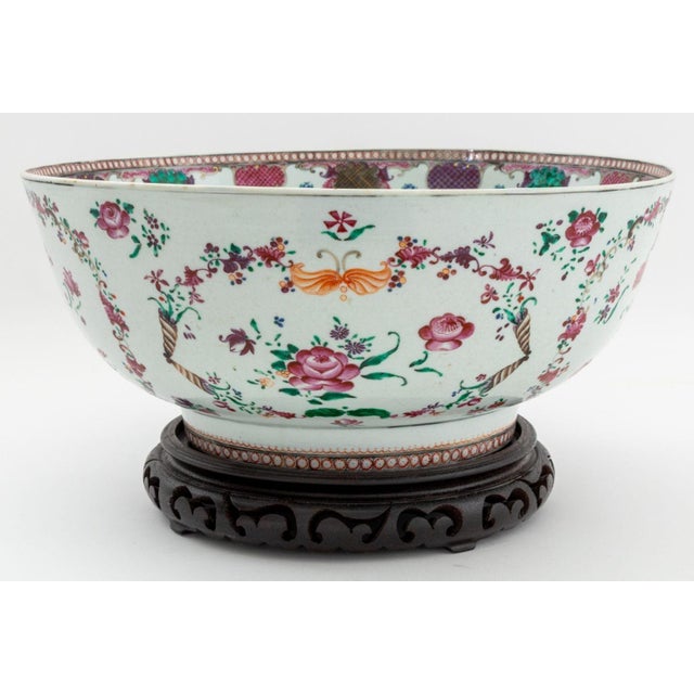 Chinese Export Famille Rose Porcelain Large Punch Bowl, with hand-painted floral motif and carved wood stand. Bowl: 6.25"...
