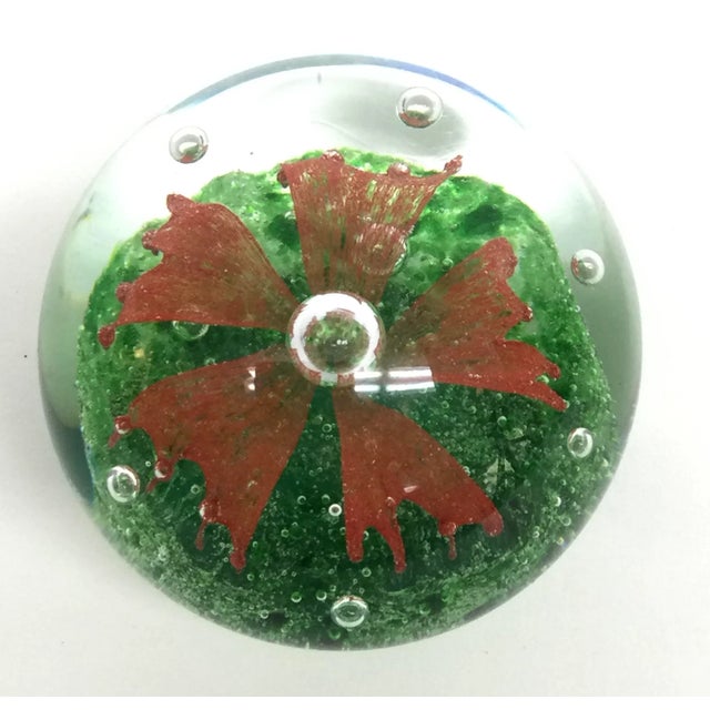 Heavy glass paperweight to add style and color to your home office. In wonderful condition with no scratches.