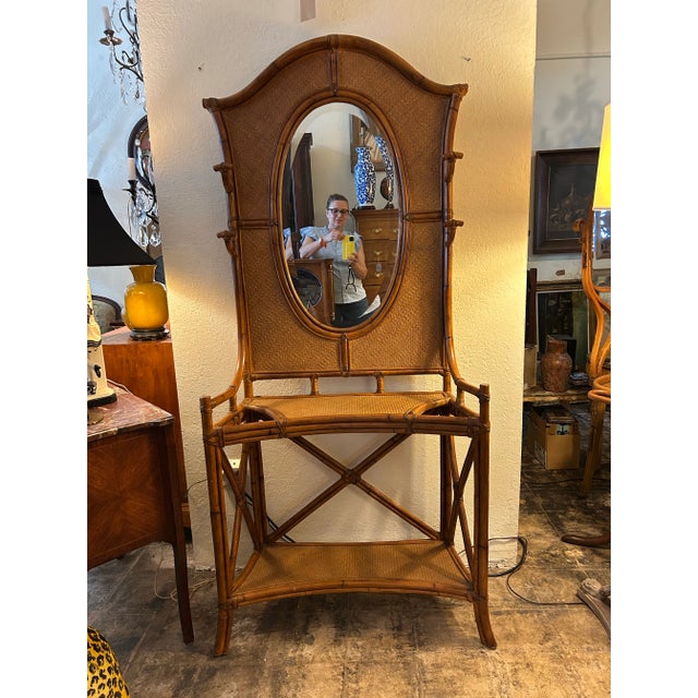 Standout Boho Chic vintage hall tree crafted with a bamboo frame with four hat hooks, grass cloth panels, beveled oval...