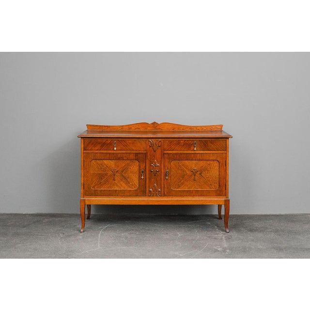 Item: Sideboard / Credenza Period & Style: Art Nouveau - Early 20th Century Features: - Elegant and practical piece of...