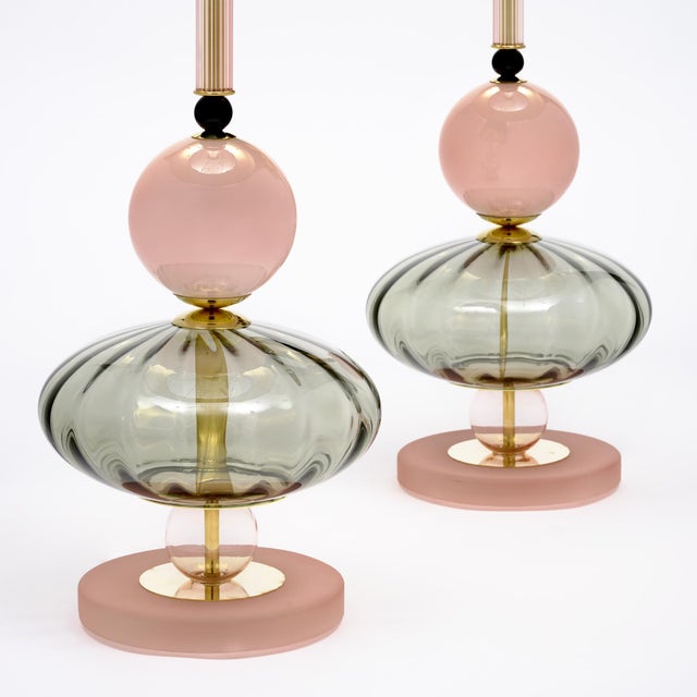 Pair of hand-blown Murano glass lamps featuring unique glass components on a brass structure. In the style of iconic...