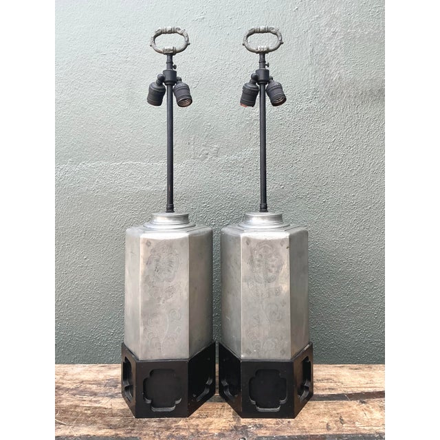This striking pair of table lamps features a timeless hexagonal silhouette inspired by traditional Chinese tea caddies....