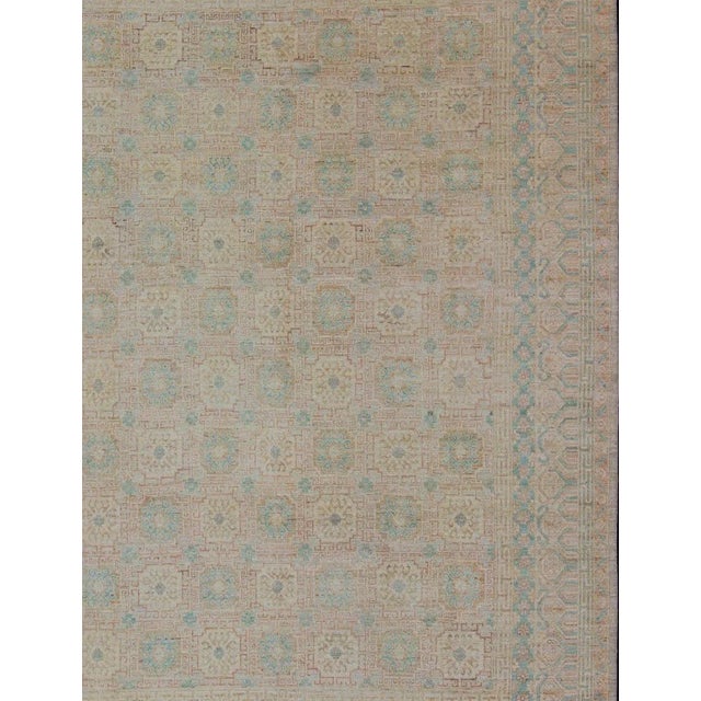 Measures: 10 x 13'8. Khotan Design rug with Geometric Medallions in turquoise and tan. Khotan Design Rug with Geometric...