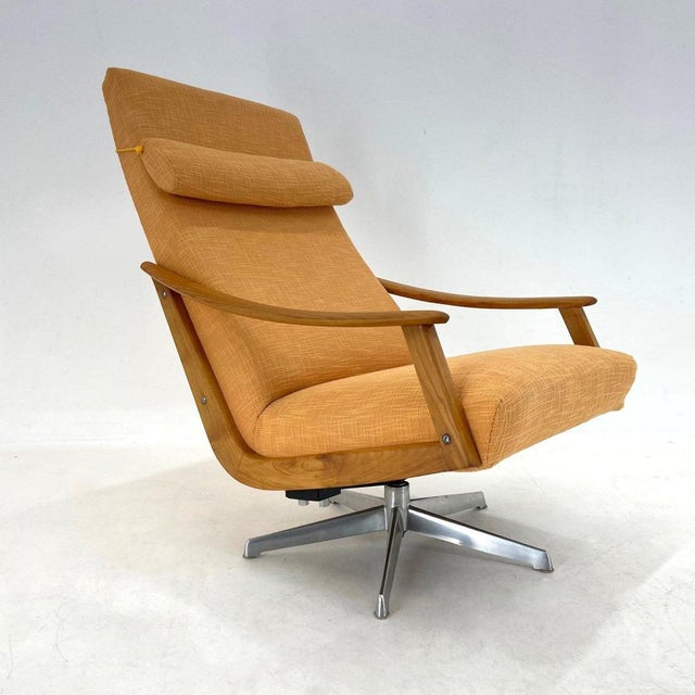 Beautiful rare, rotating armchair designed by Adolf Wrenger and produced by his company in the 1950's. The upholstery is...