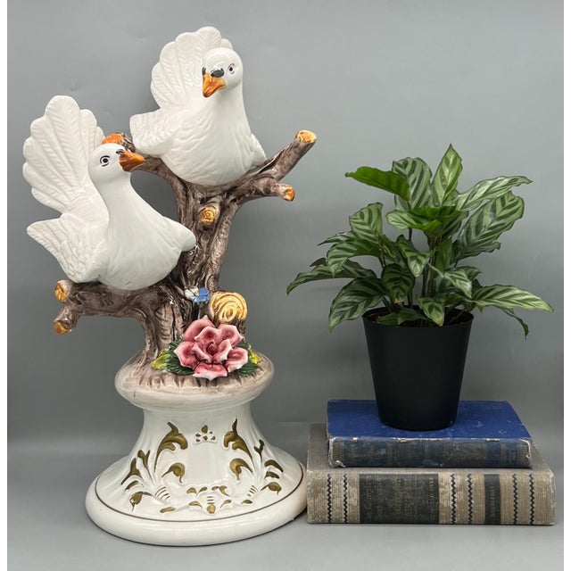 Exquisite piece made by Capodimonte in Italy in the mid to late 20th century. This large ceramic piece depicts a pair of...