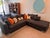 The Architecte sectional by Nathan Anthony. With its stunning double-stacked wood base with shiny metal corners acts like...