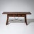 Spanish table or bench with a height of 54 cm. The piece rests on baluster legs with twisted shafts and an iron stretcher....