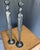 A striking and sophisticated pair of late-20th-century figurative candlesticks, heavily channeling the modernist...