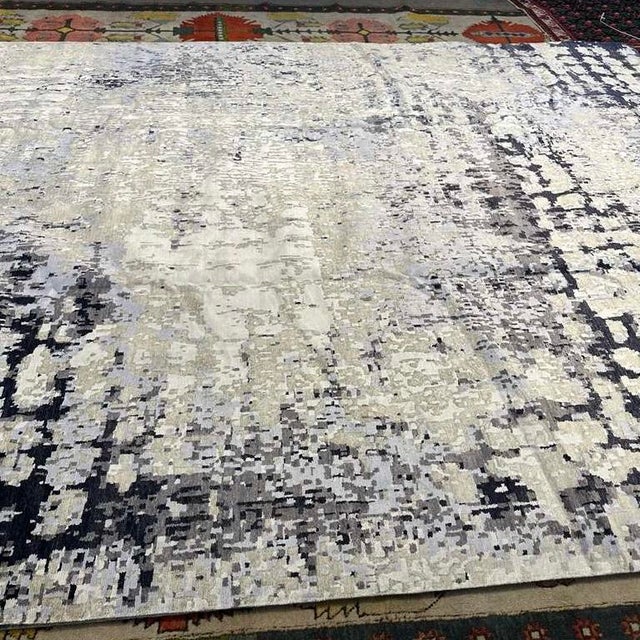 This hand-knotted rug from Nepal is a striking example of where fine craftsmanship meets contemporary design. At 10' x...