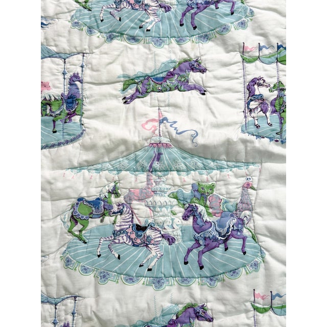 Step into a whimsical storybook world with this charming handmade vintage baby quilt, handmade with love in the...