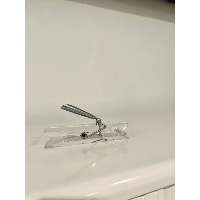 Very cool vintage lucite single pen holder in the shape of an oversized clear clothespin. The silver makes a beautiful...