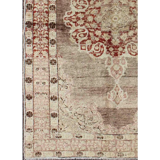 Tribal Vintage Turkish Oushak Rug With Faded Plum and Cream Tones 4′ × 6′3″ For Sale - Image 3 of 7