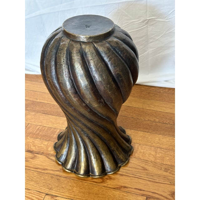 Elegant and sculptural hand-hammered brass vase by Italian designer Egidio Casagrande, renowned for his exquisite...