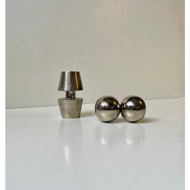 A set of 2 decorative desk ornaments or paperweight. Abstract minimalist styling that resembles two dumbbells. Both rather...