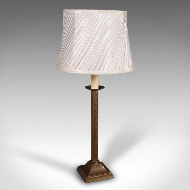 This is a vintage table lamp. An English, brass desk or side light with ecclesiastical taste, dating to the late 20th...