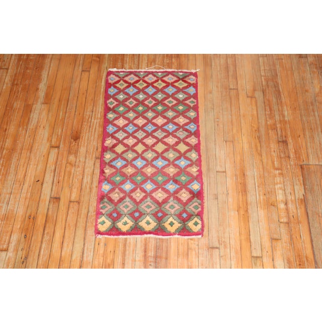 A mid 20th-century wool hand-knotted Turkish Deco scatter size colorful rug