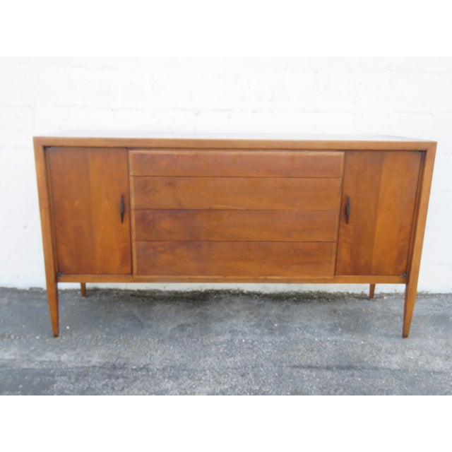 This magnificent Sideboard is made of wood, solid wood, walnut, and veneer. This Sideboard was made by Century Furniture,...