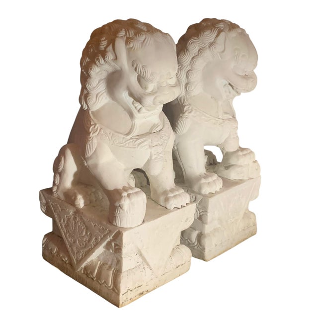A beautiful pair of solid, white marble Foo Dogs, most likely late 19th/early 20th Century.
